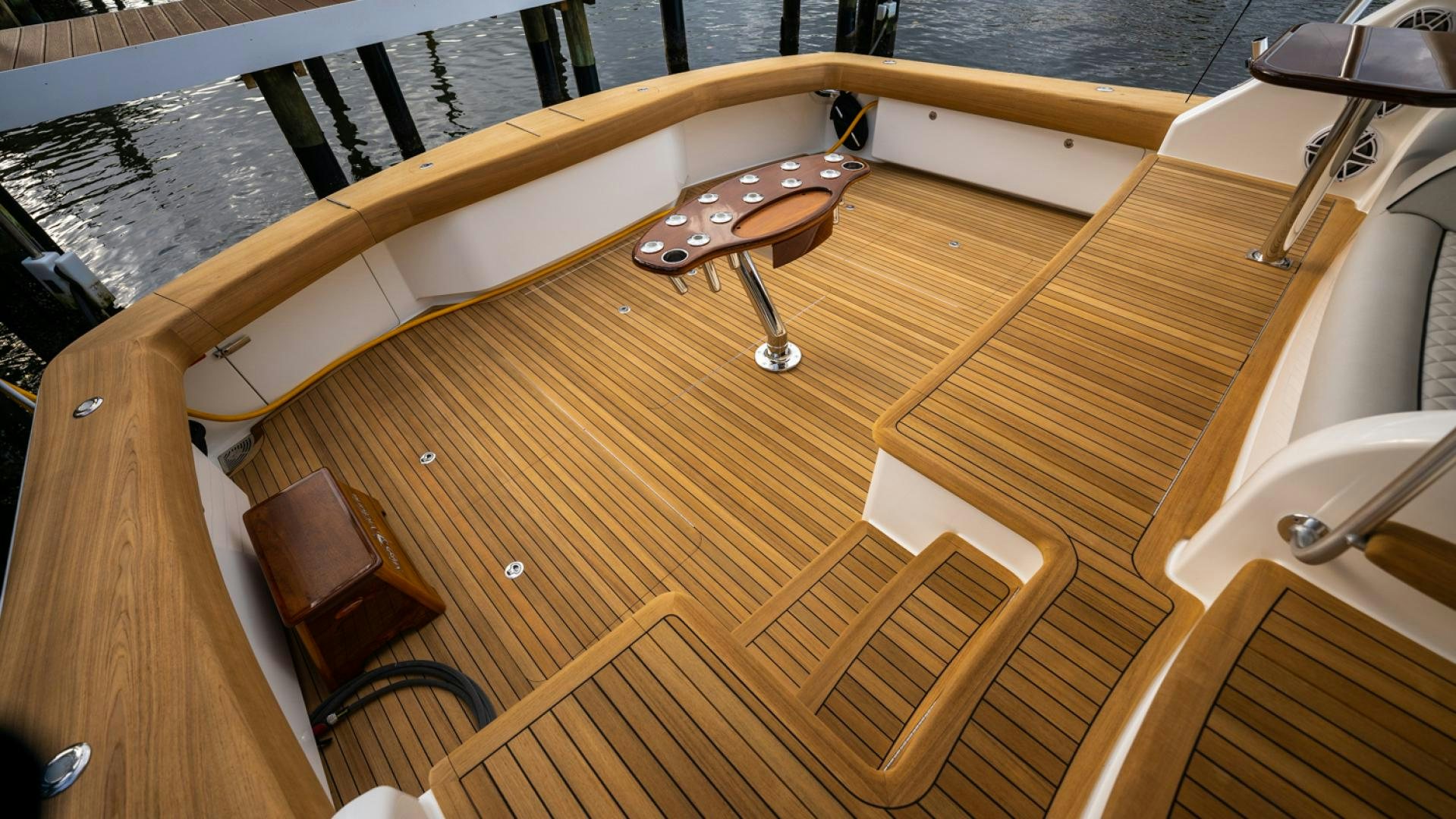 a wooden boat on a deck aboard WHY WOULDN'T WE Yacht for Sale