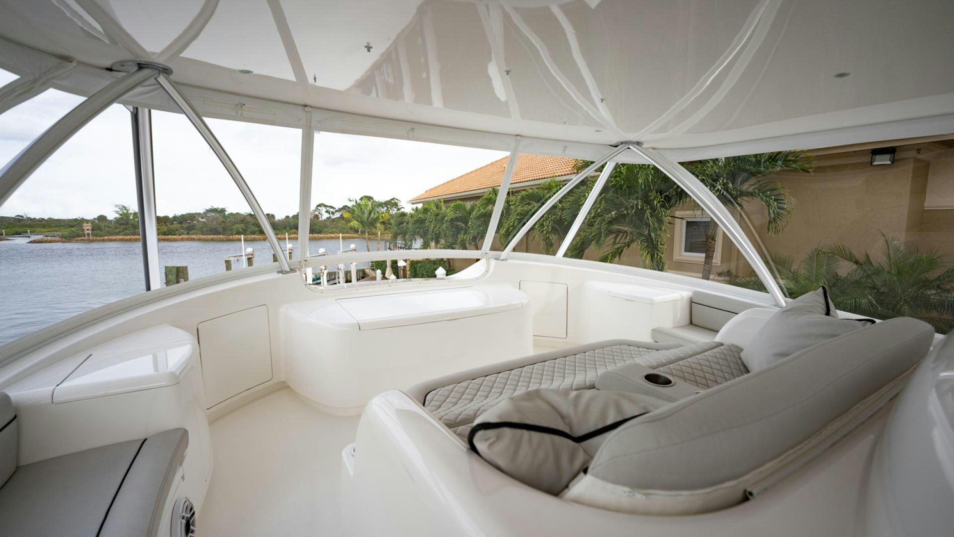 a room with a bed and a hammock aboard WHY WOULDN'T WE Yacht for Sale