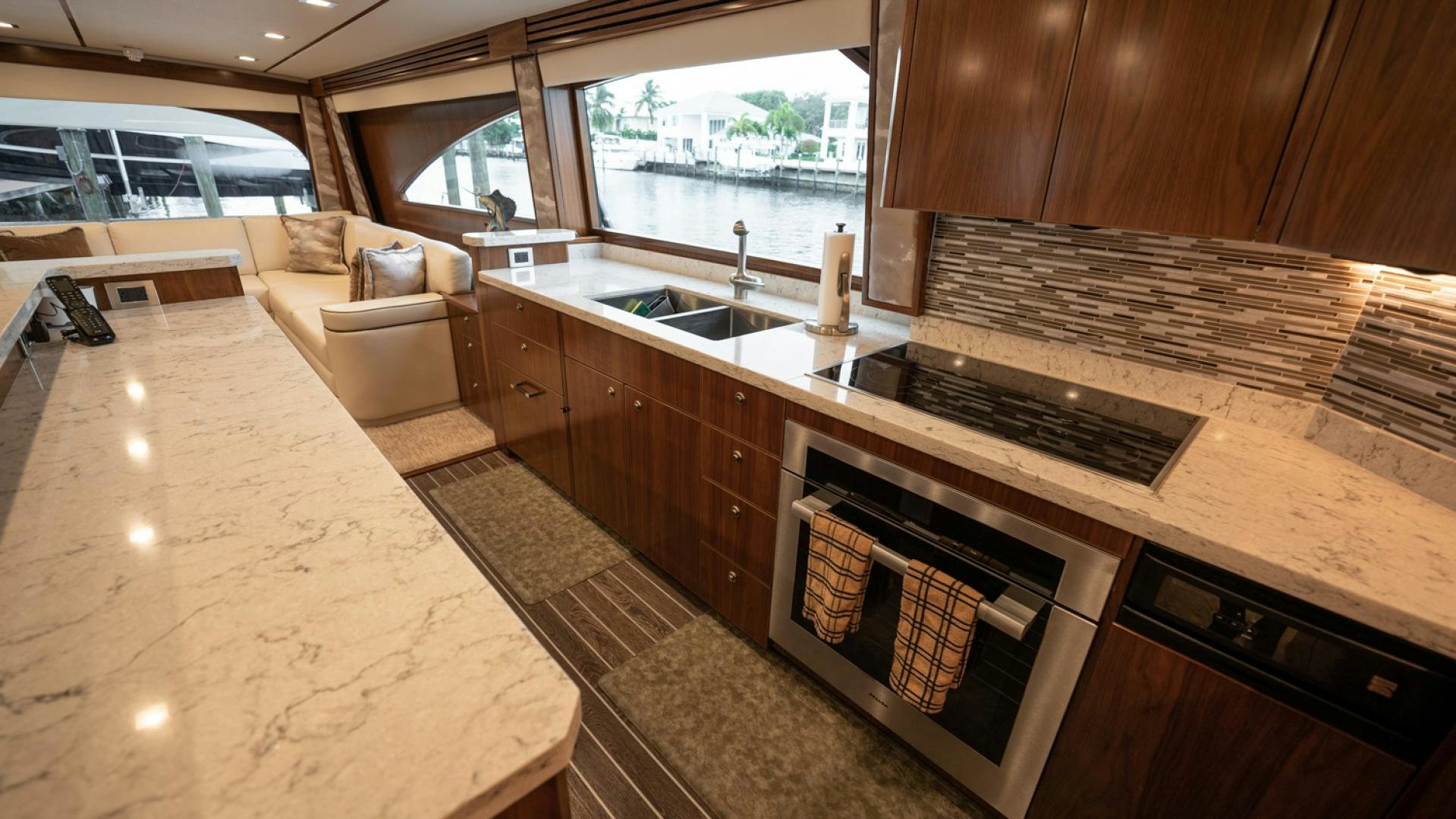 a kitchen with a fireplace aboard WHY WOULDN'T WE Yacht for Sale