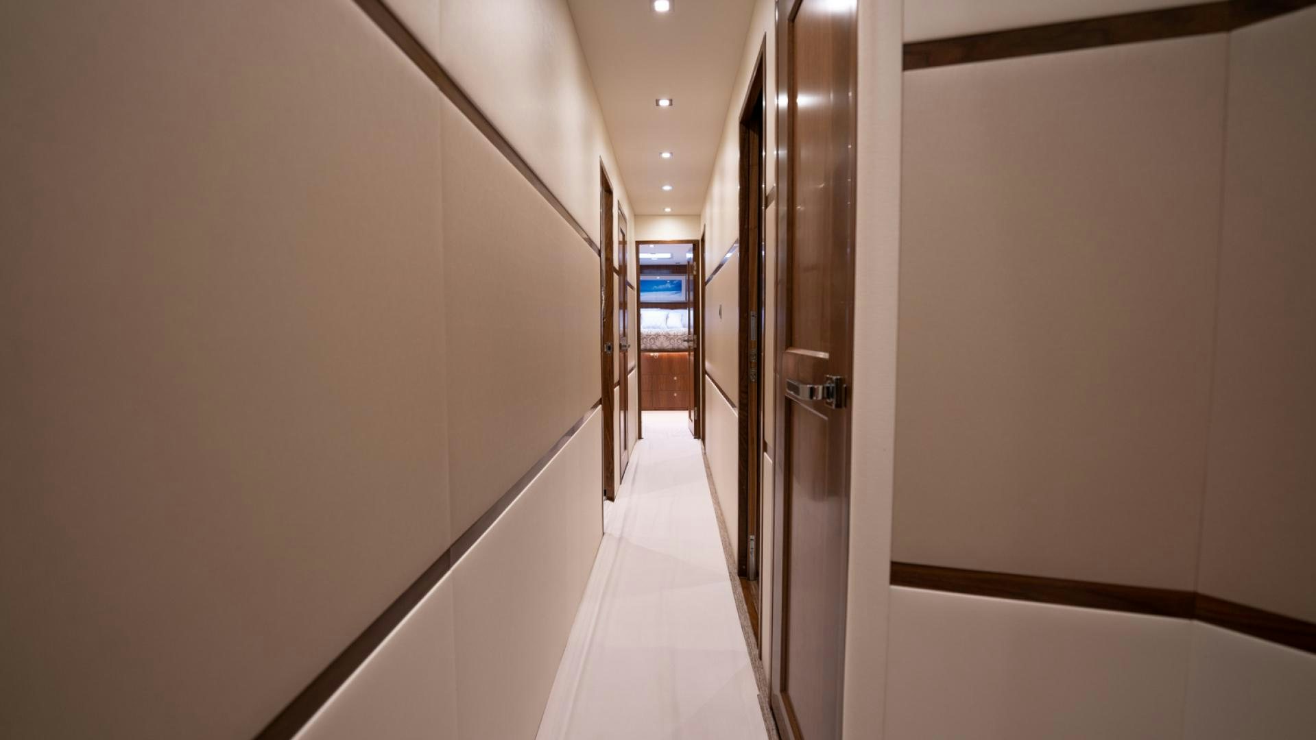 a hallway with doors aboard WHY WOULDN'T WE Yacht for Sale