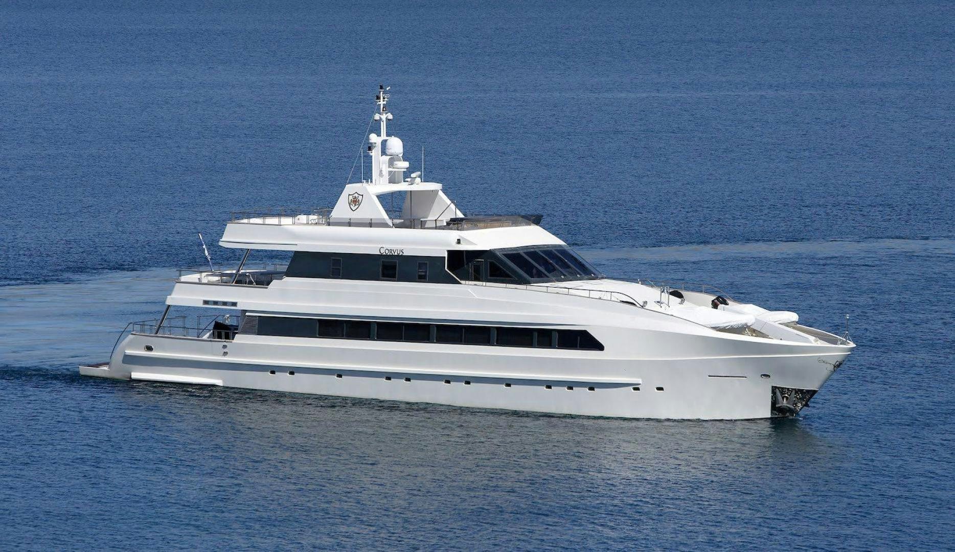 a white yacht in the water aboard CORVUS Yacht for Sale