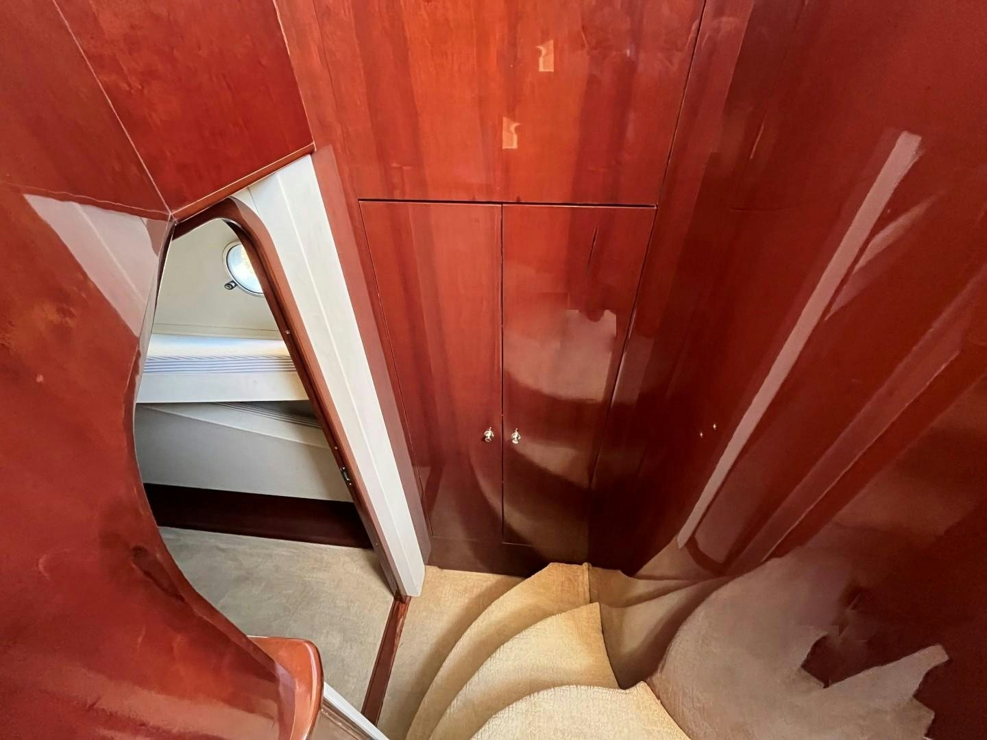 a staircase with a glass window aboard SELAH WAY Yacht for Sale