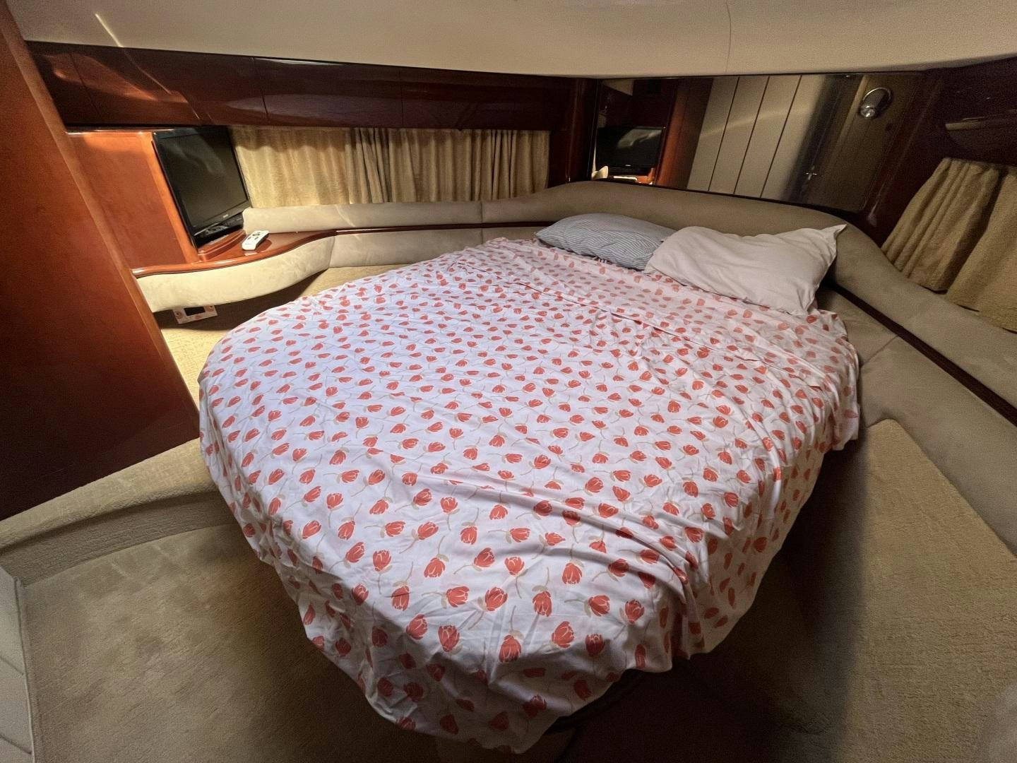 a bed with a red and white checkered blanket aboard SELAH WAY Yacht for Sale