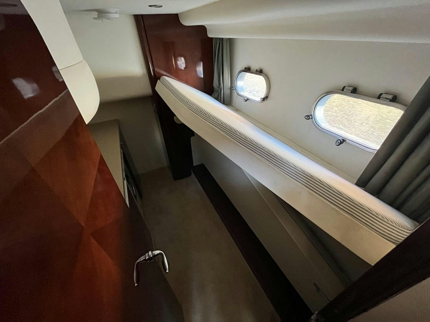 a view of a hallway with a window and a door aboard SELAH WAY Yacht for Sale