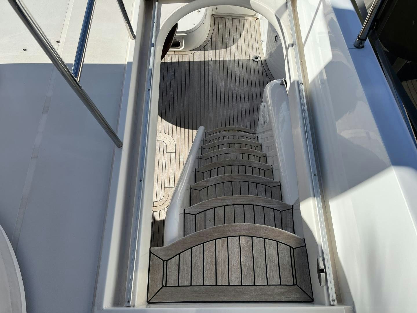 a staircase with a metal railing aboard SELAH WAY Yacht for Sale