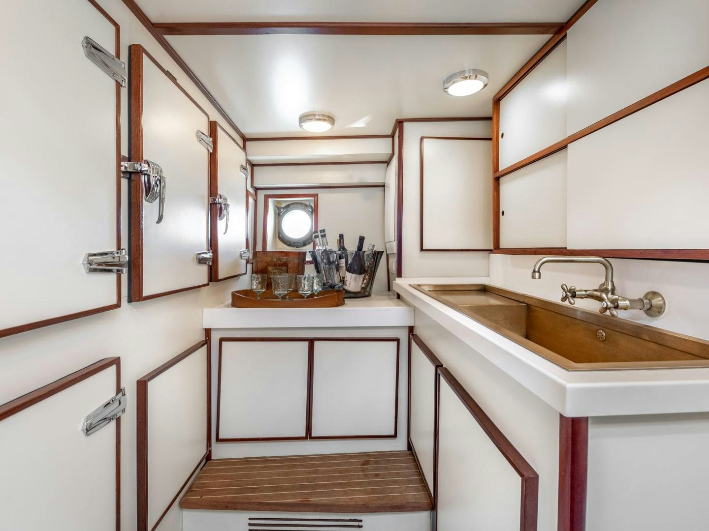 a bathroom with a sink and cabinets aboard WEATHERBIRD Yacht for Sale