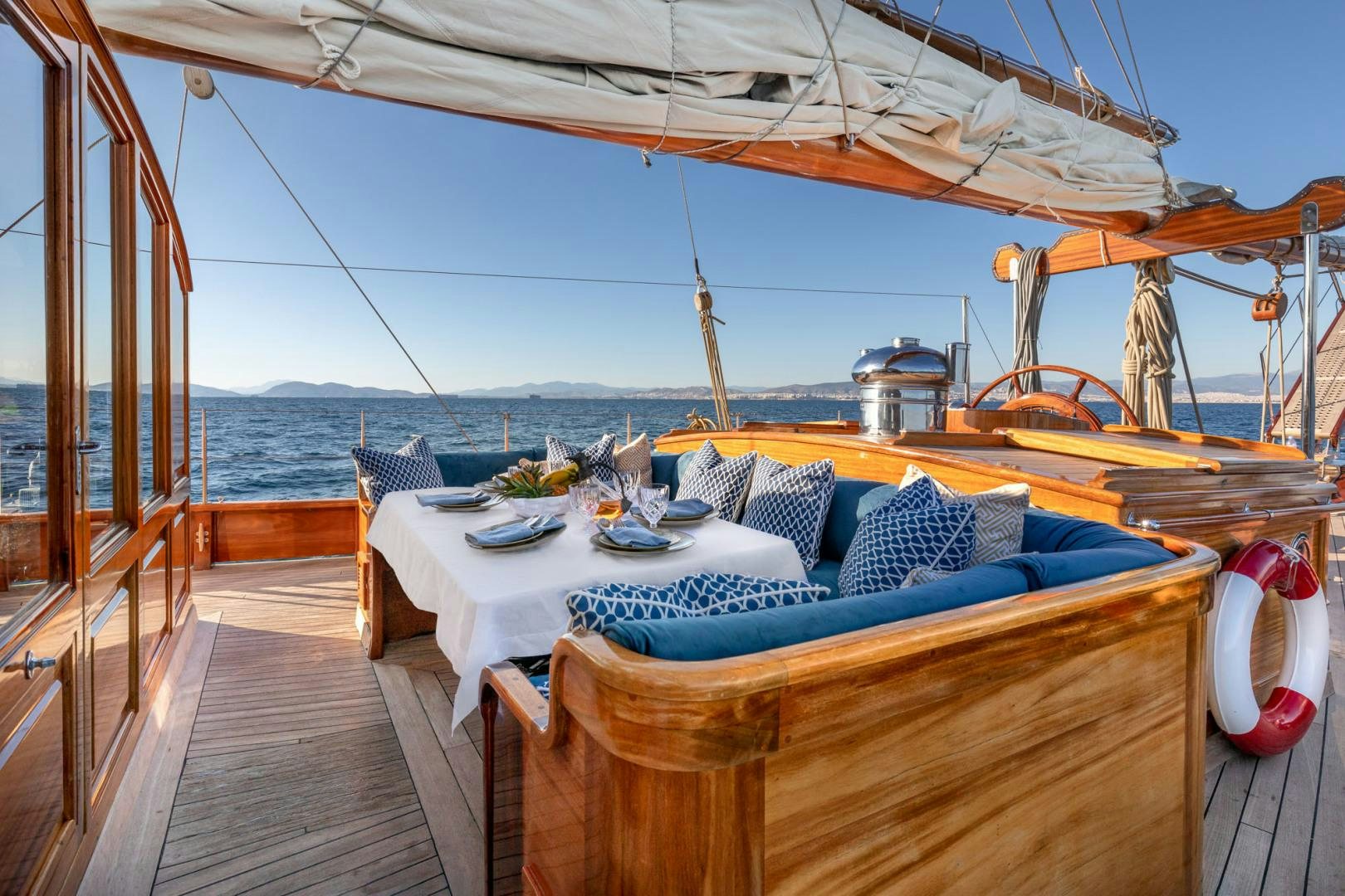 a table on a deck aboard WEATHERBIRD Yacht for Sale