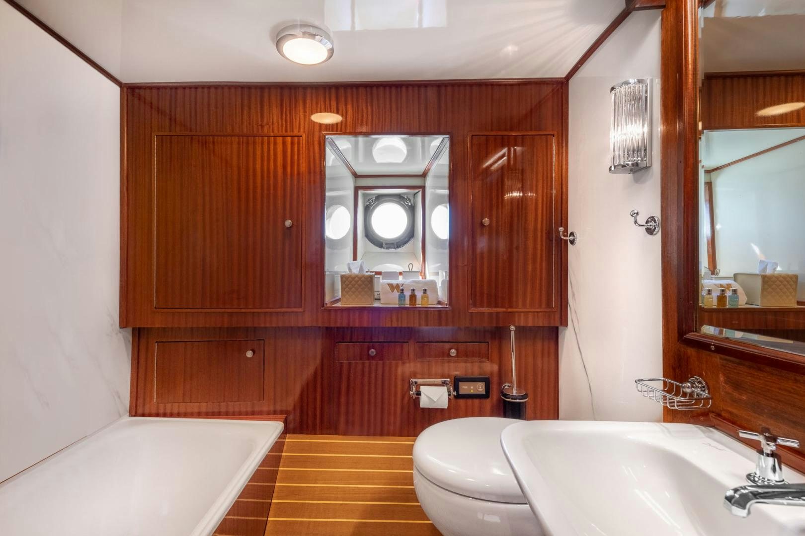 a bathroom with a sink and a toilet aboard WEATHERBIRD Yacht for Sale