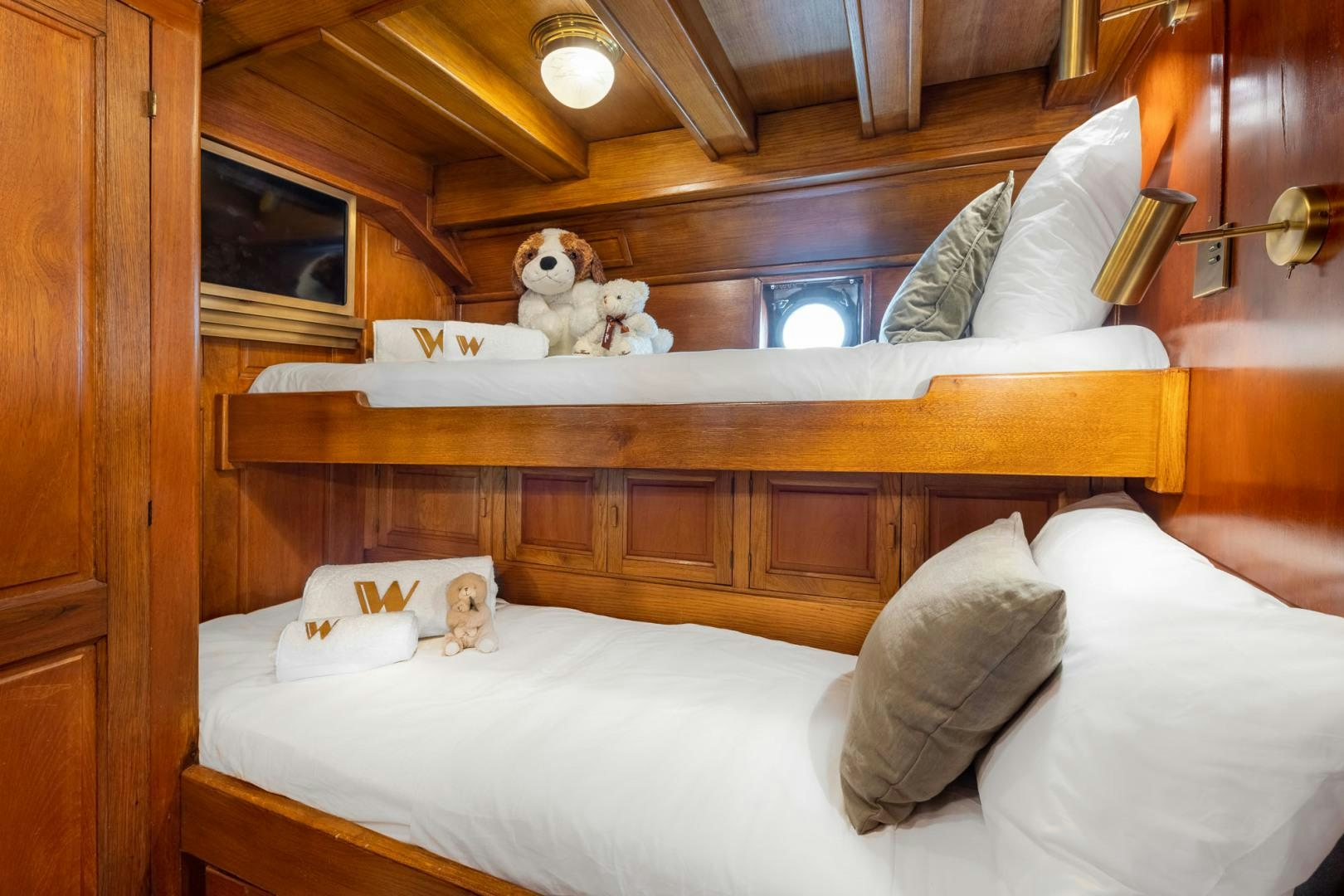 a bed with stuffed animals on the top aboard WEATHERBIRD Yacht for Sale