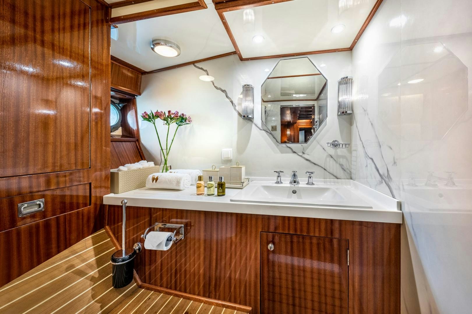 a bathroom with a sink and cabinets aboard WEATHERBIRD Yacht for Sale
