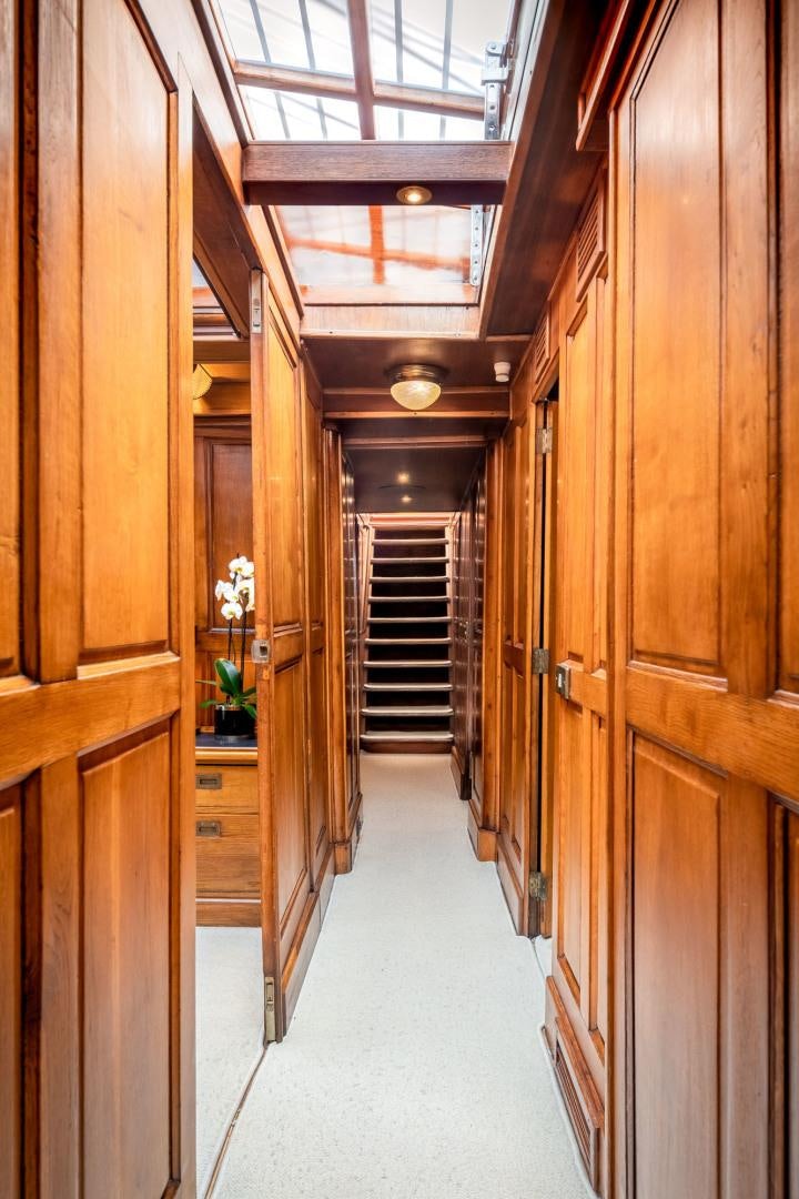 a hallway with wood walls aboard WEATHERBIRD Yacht for Sale
