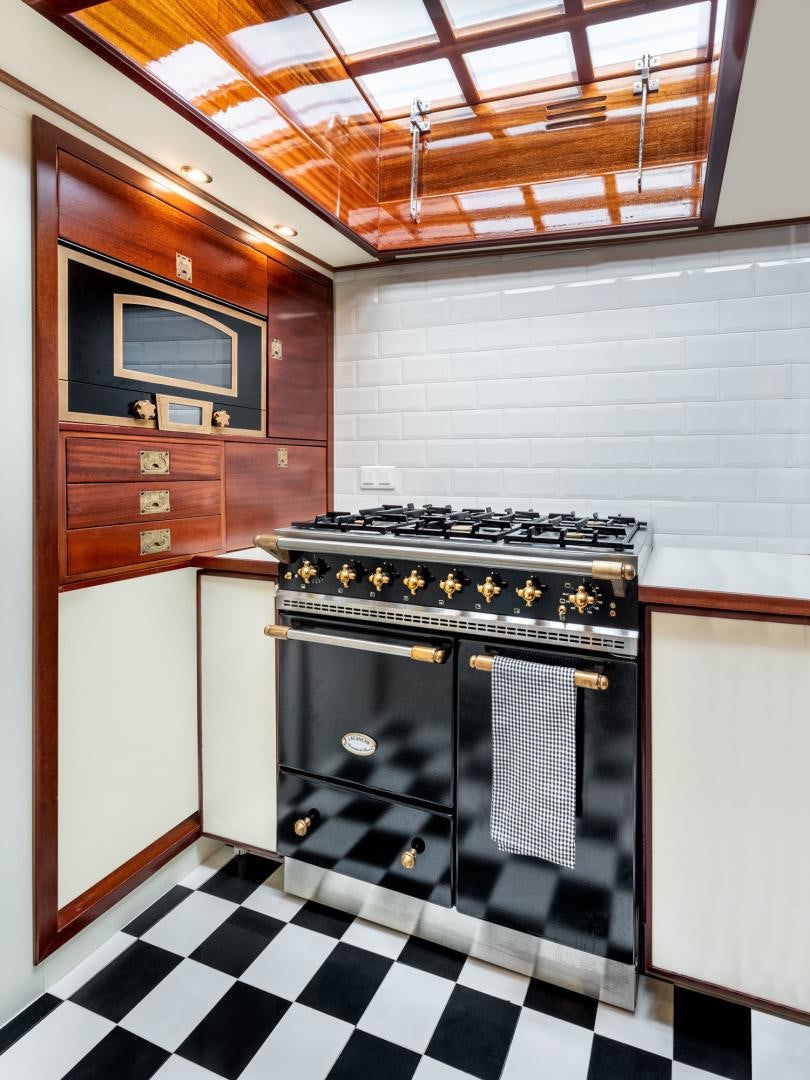 a kitchen with a stove and oven aboard WEATHERBIRD Yacht for Sale
