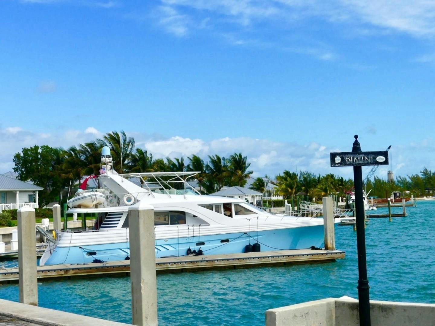 a boat docked at a pier aboard Applaus Yacht for Sale