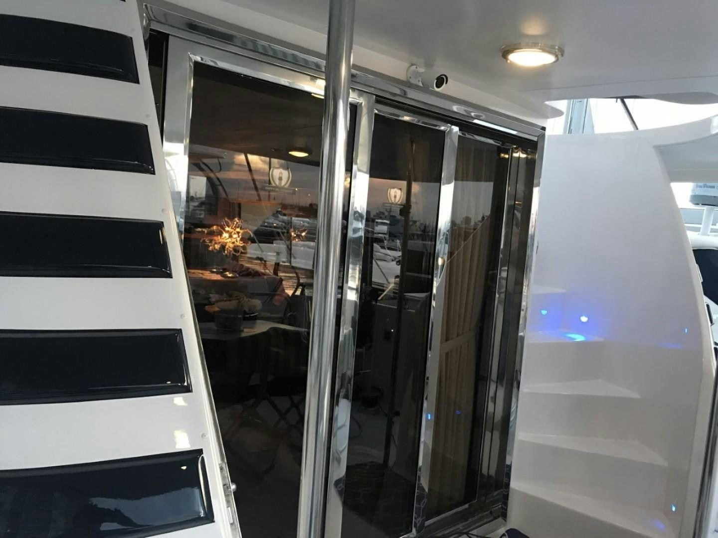 a glass door with a black and white striped wall aboard Applaus Yacht for Sale