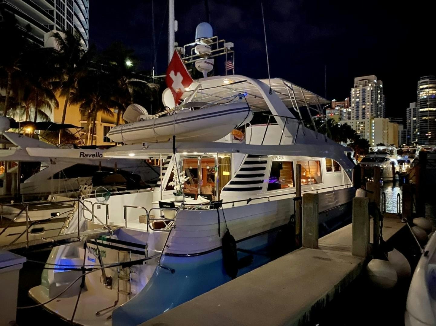 a boat docked at night aboard Applaus Yacht for Sale