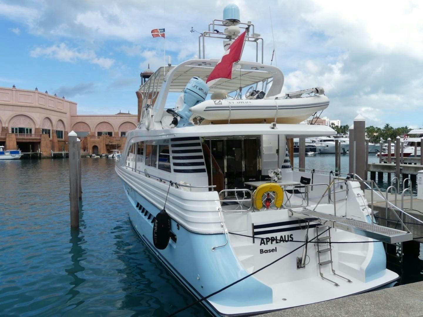 a boat docked at a pier aboard Applaus Yacht for Sale