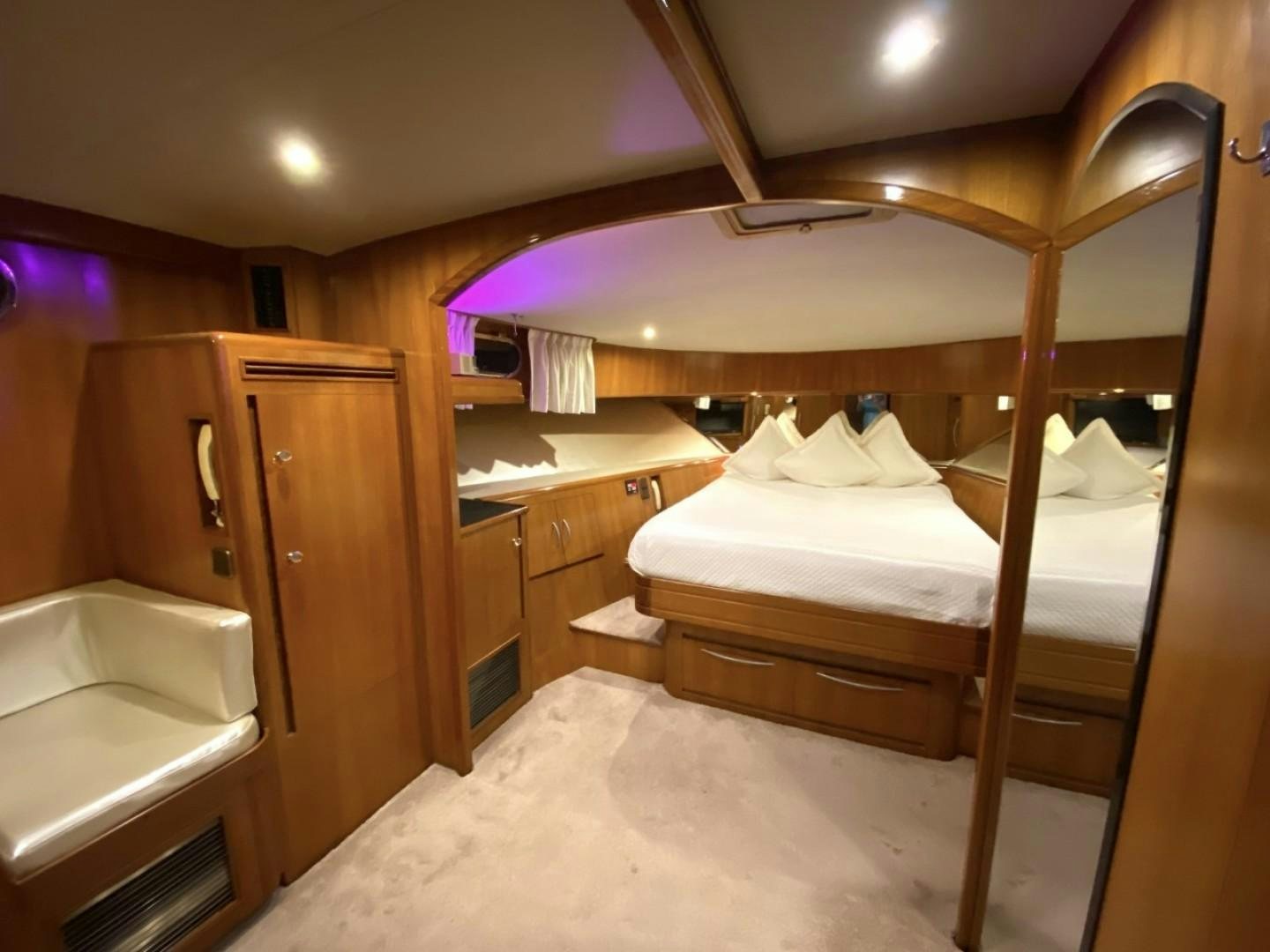 a bed in a room aboard Applaus Yacht for Sale