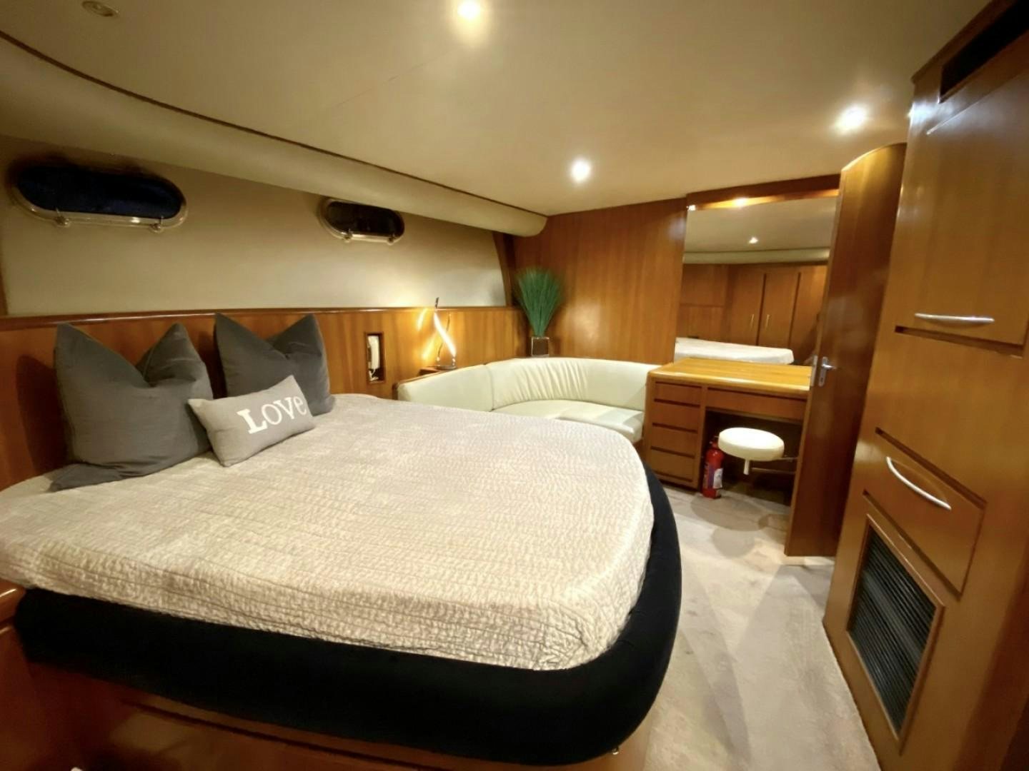 a hotel room with a bed and a desk aboard Applaus Yacht for Sale
