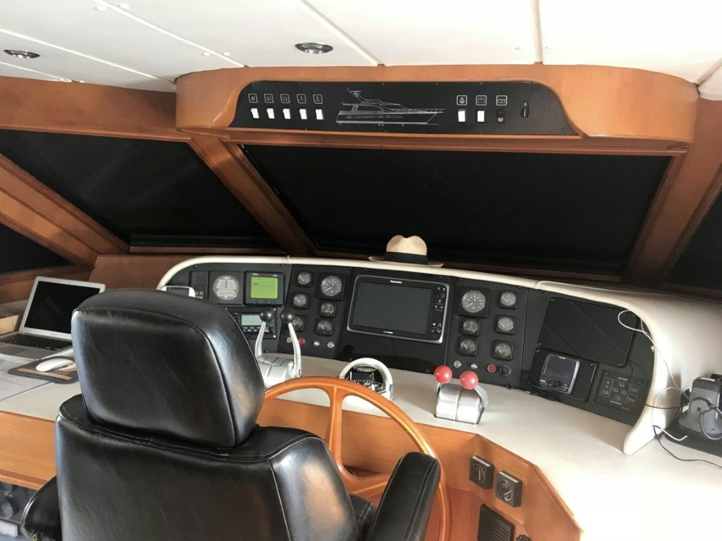 a black electronic device on a wooden desk aboard Applaus Yacht for Sale