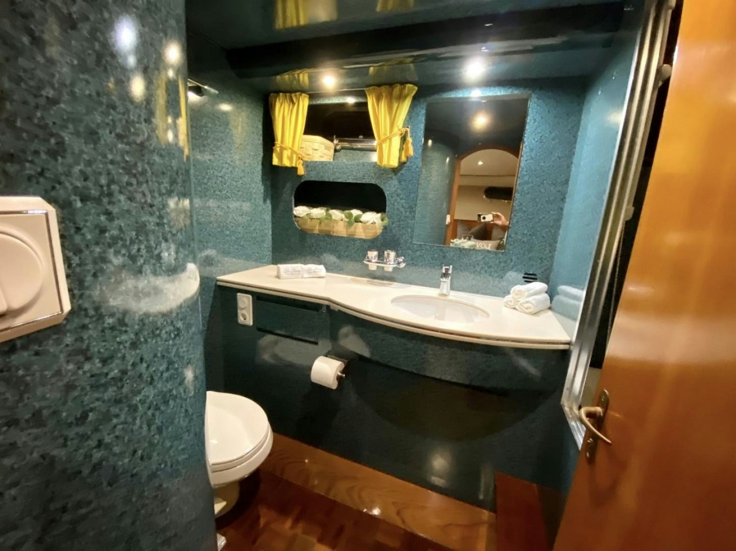 a bathroom with a large mirror aboard Applaus Yacht for Sale