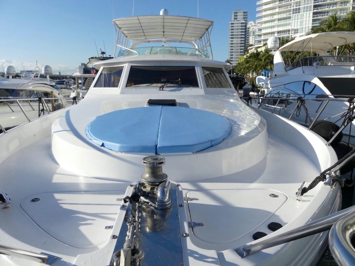 a white boat with a blue roof aboard Applaus Yacht for Sale