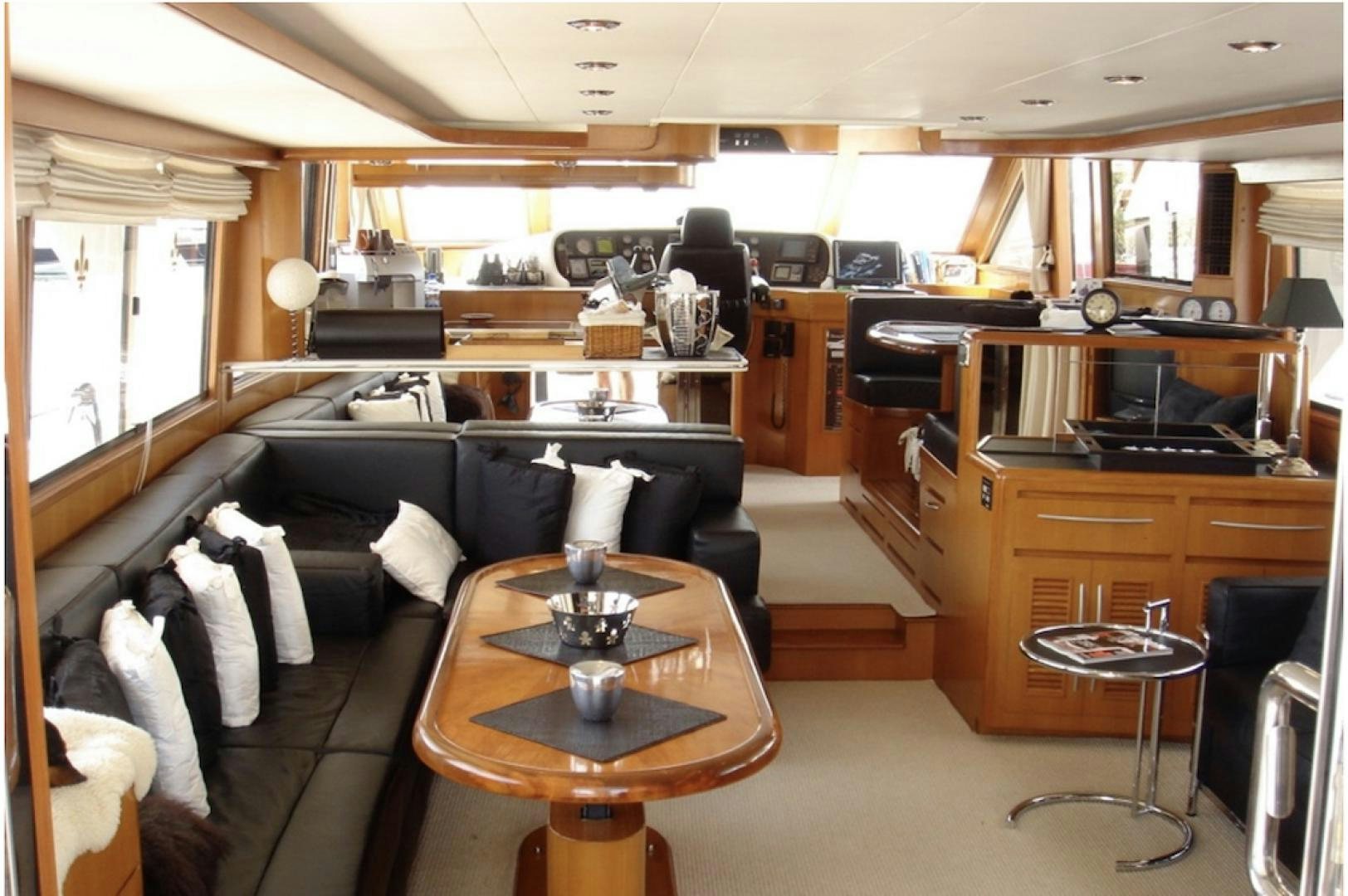 a room with a couch and a table aboard Applaus Yacht for Sale
