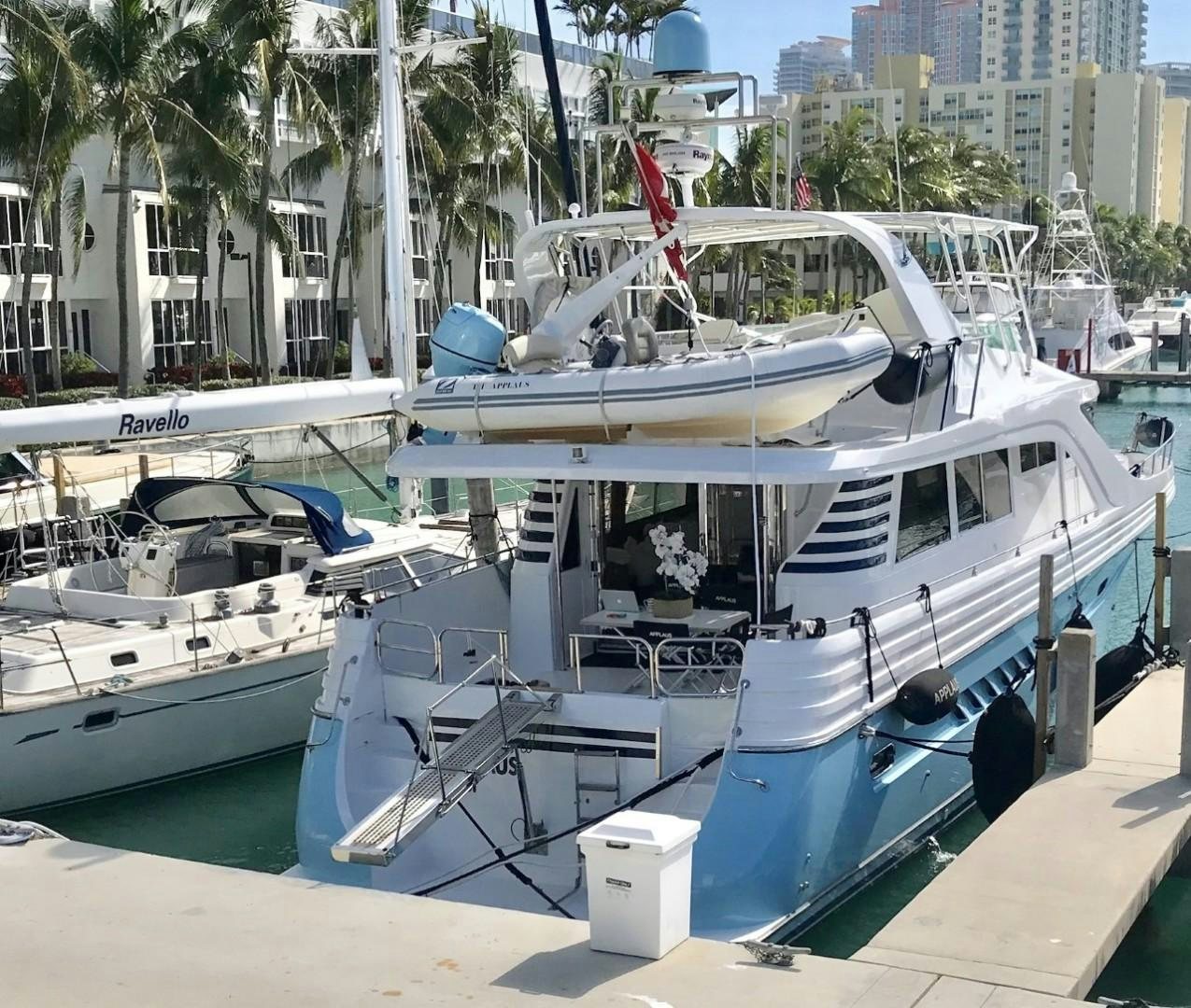 several boats docked at a pier aboard Applaus Yacht for Sale