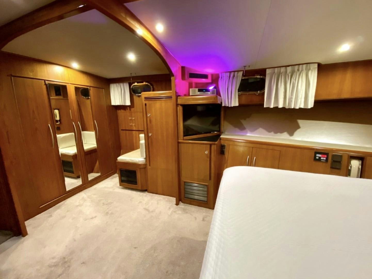 a bedroom with a bed and a closet aboard Applaus Yacht for Sale