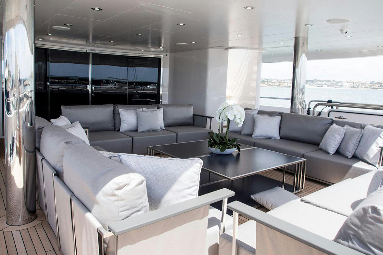 a living room with a large window aboard ALESSANDRA III Yacht for Charter