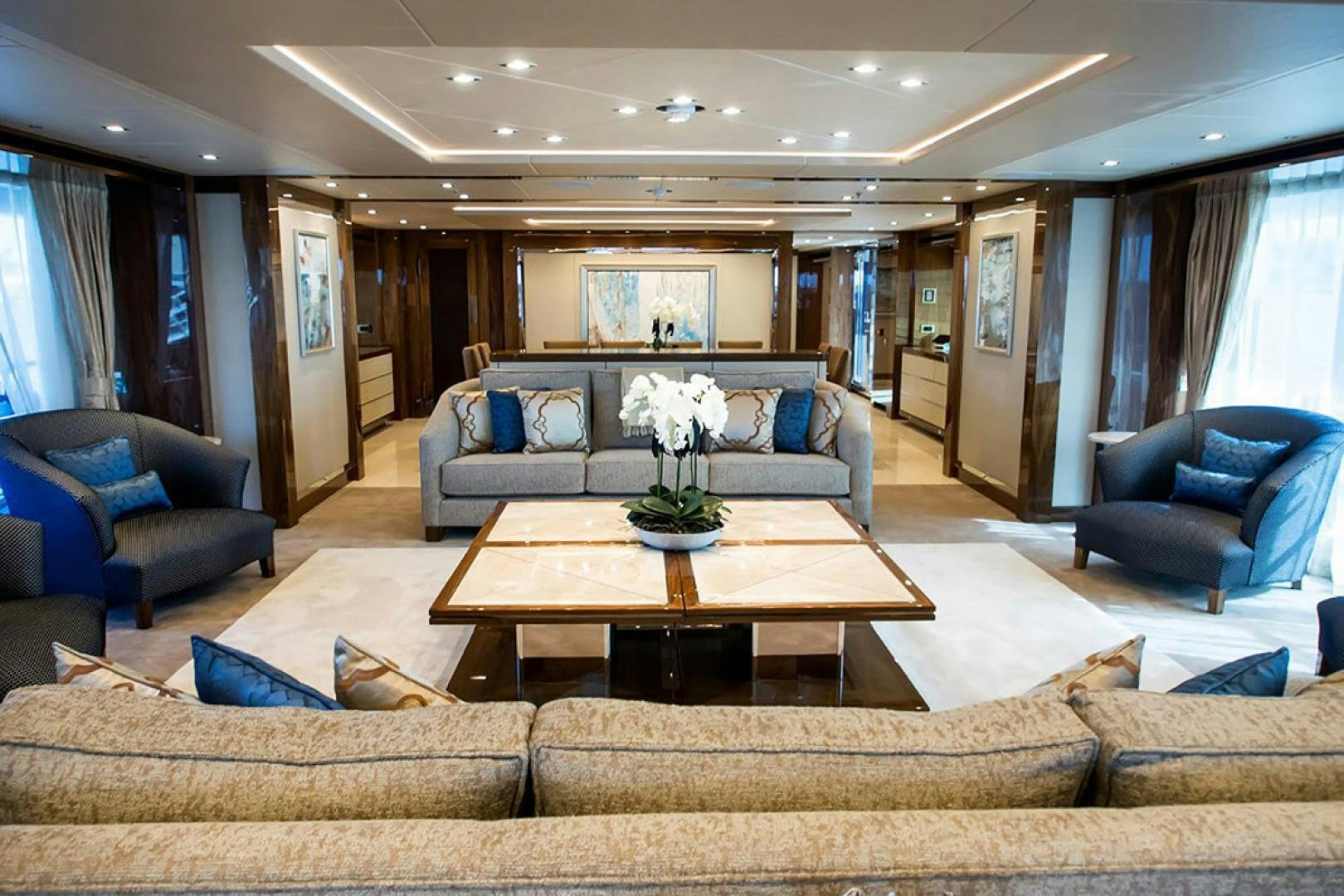 a living room with a couch and a coffee table aboard ALESSANDRA III Yacht for Sale