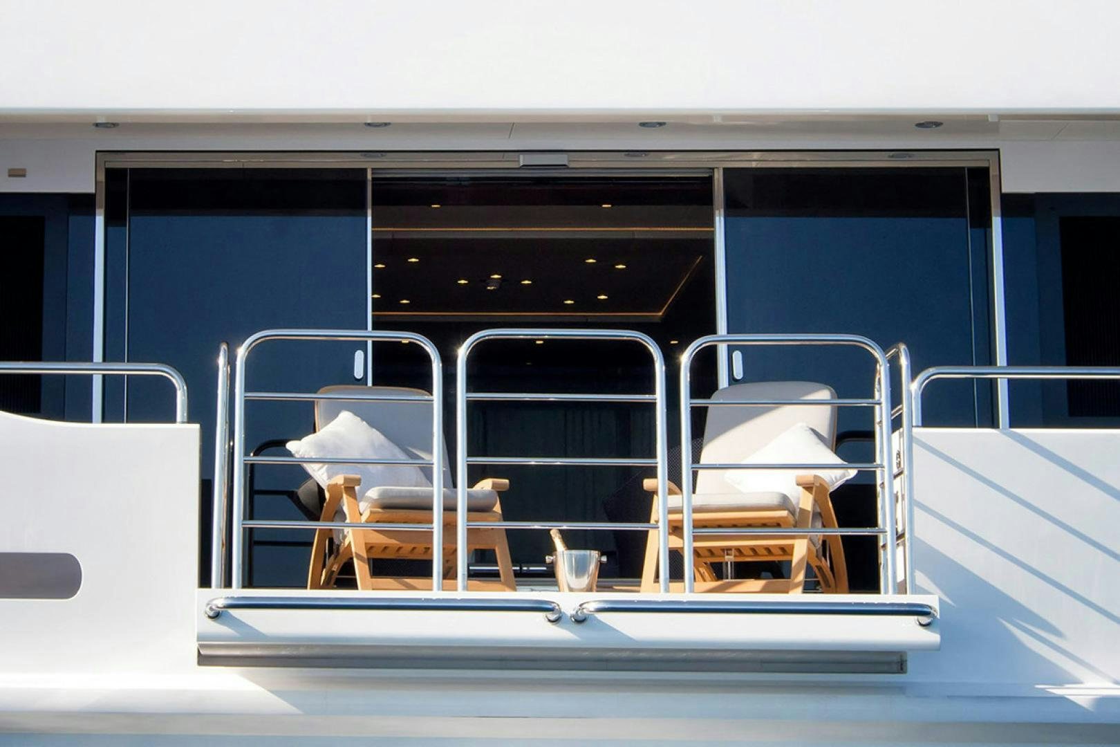 a group of chairs on a balcony aboard ALESSANDRA III Yacht for Charter