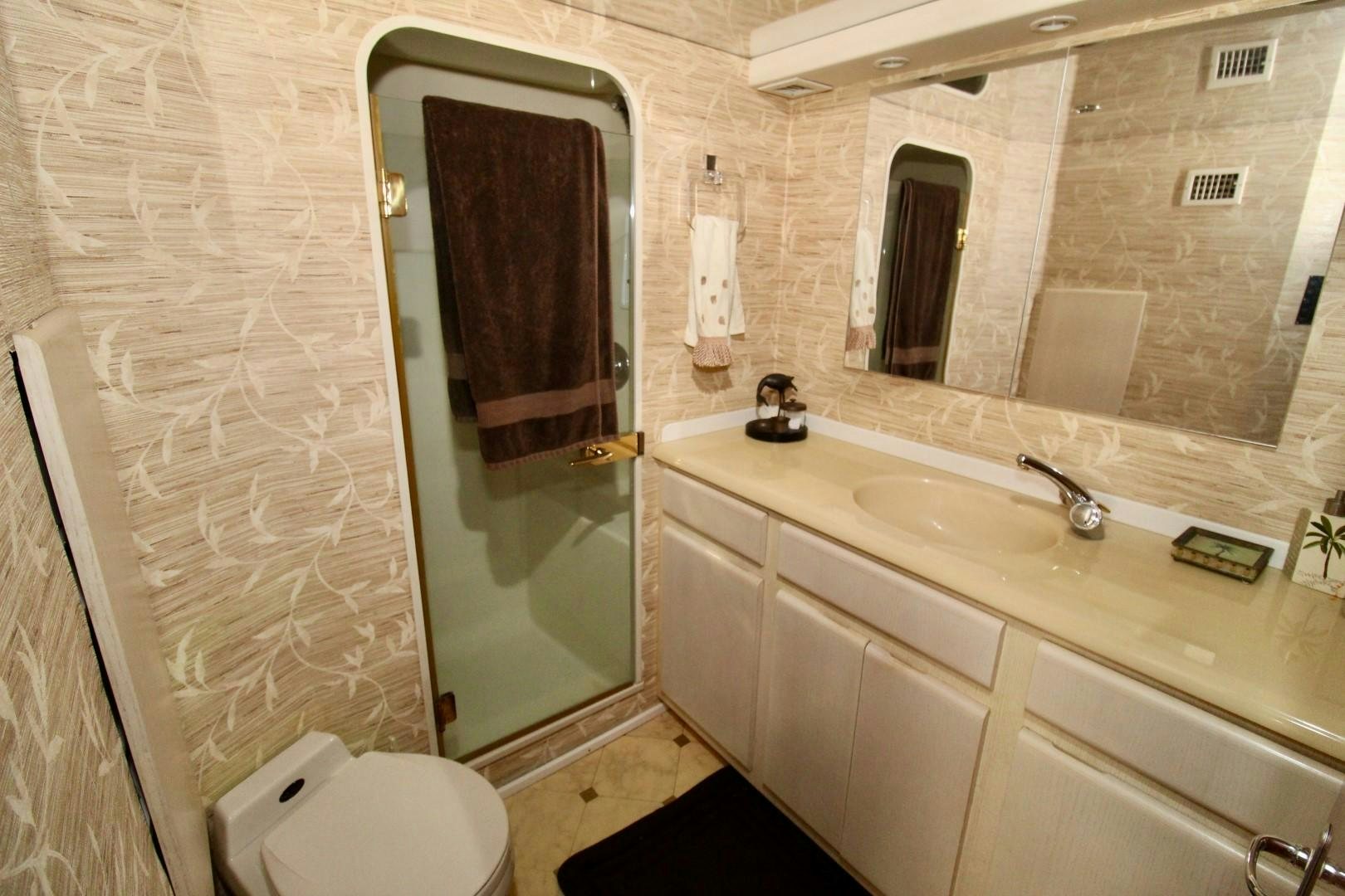 a bathroom with a sink and a toilet aboard BAD TO THE BONE Yacht for Sale