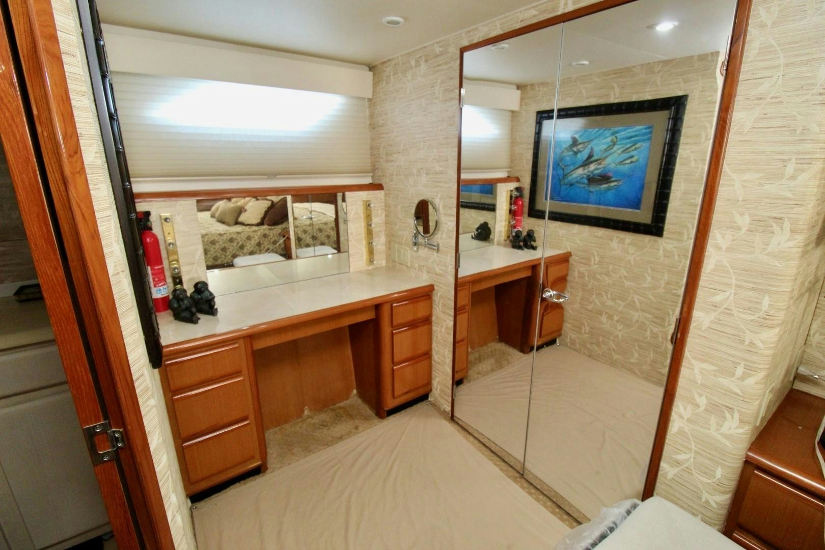 a bathroom with a large mirror aboard BAD TO THE BONE Yacht for Sale