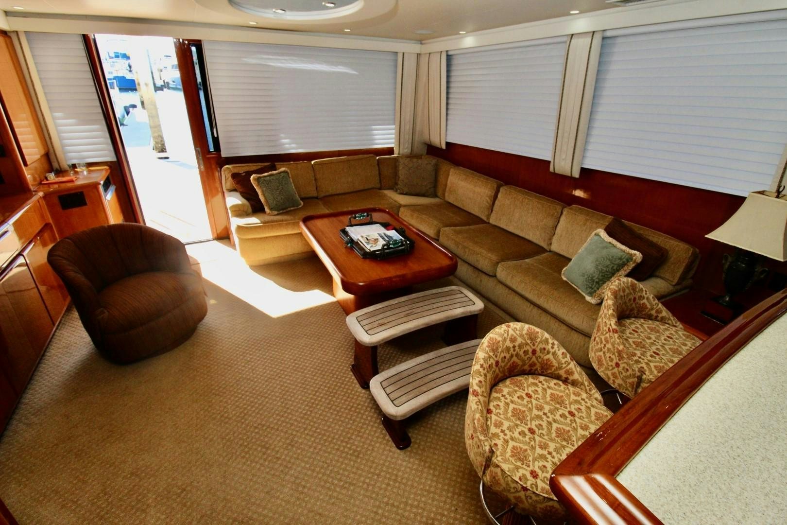 a living room with a couch and a coffee table aboard BAD TO THE BONE Yacht for Sale
