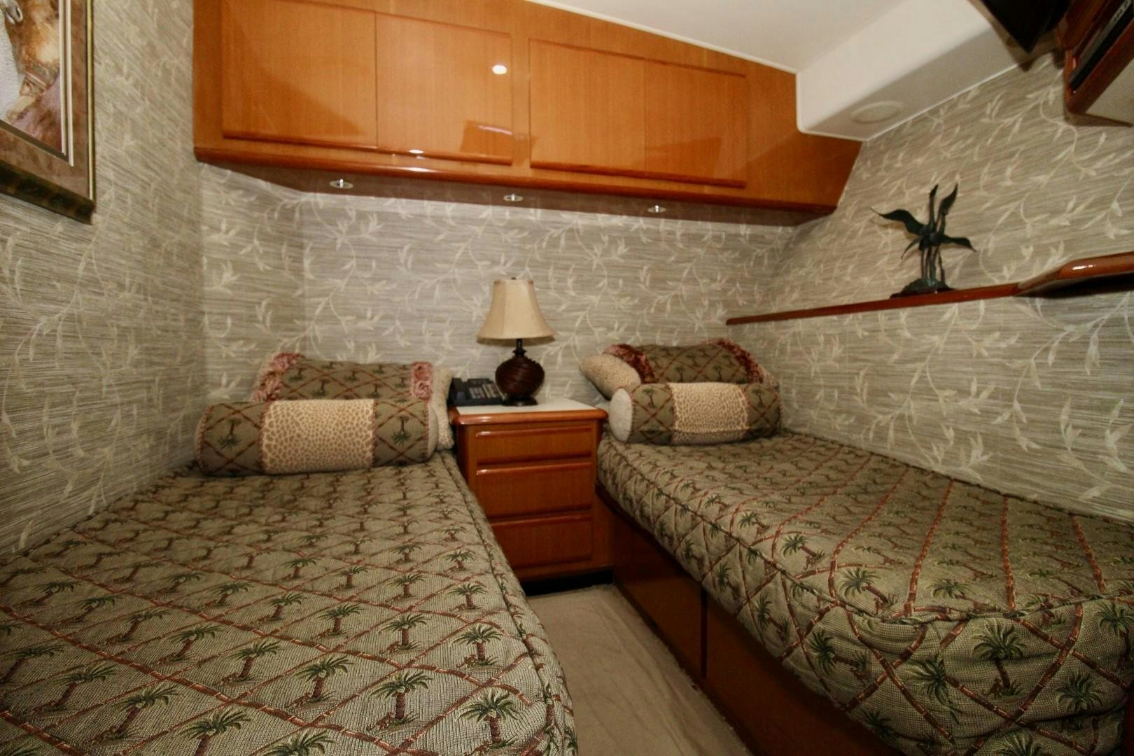a couple of beds in a hotel room aboard BAD TO THE BONE Yacht for Sale