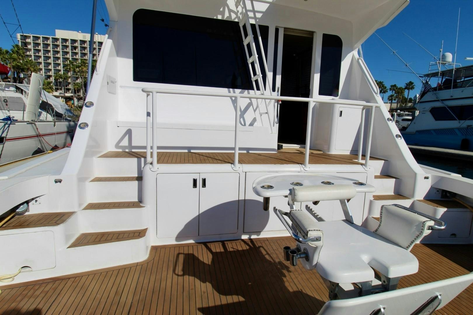 a deck with a deck and chairs aboard BAD TO THE BONE Yacht for Sale