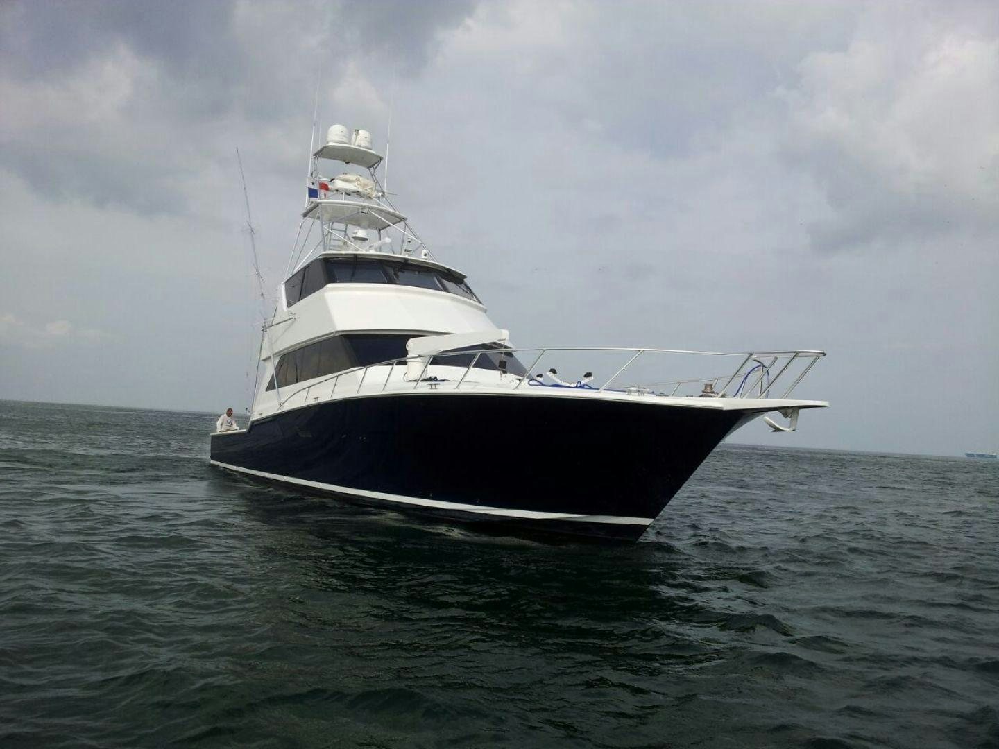 a large white boat in the water aboard BAD TO THE BONE Yacht for Sale