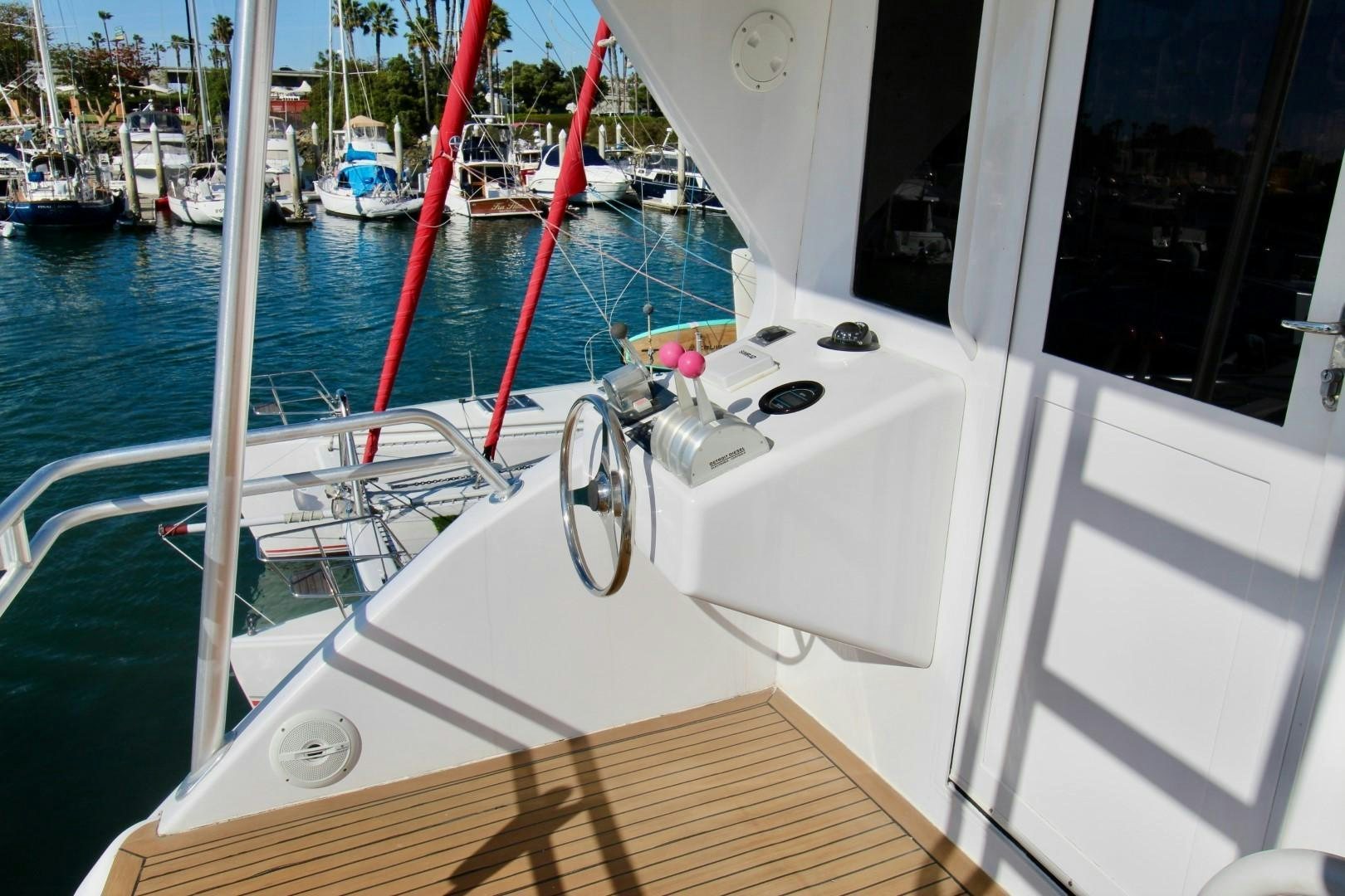 a boat with ropes on the front aboard BAD TO THE BONE Yacht for Sale