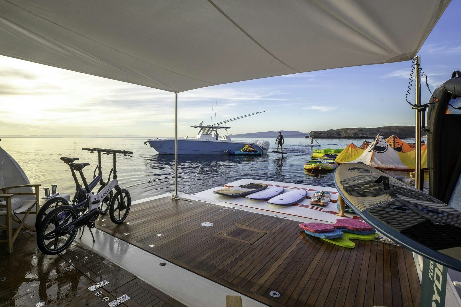 a boat is parked on the side of a lake aboard ODYSSEA Yacht for Charter
