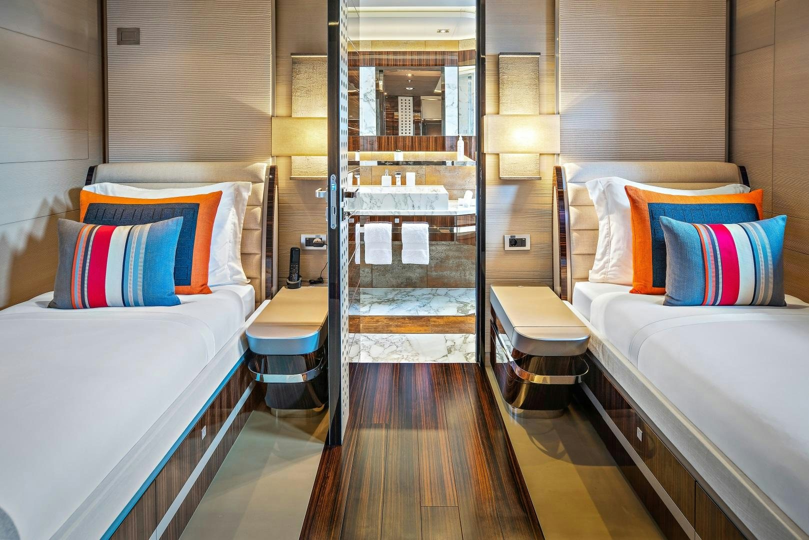 a room with a bed and a mirror aboard ODYSSEA Yacht for Charter