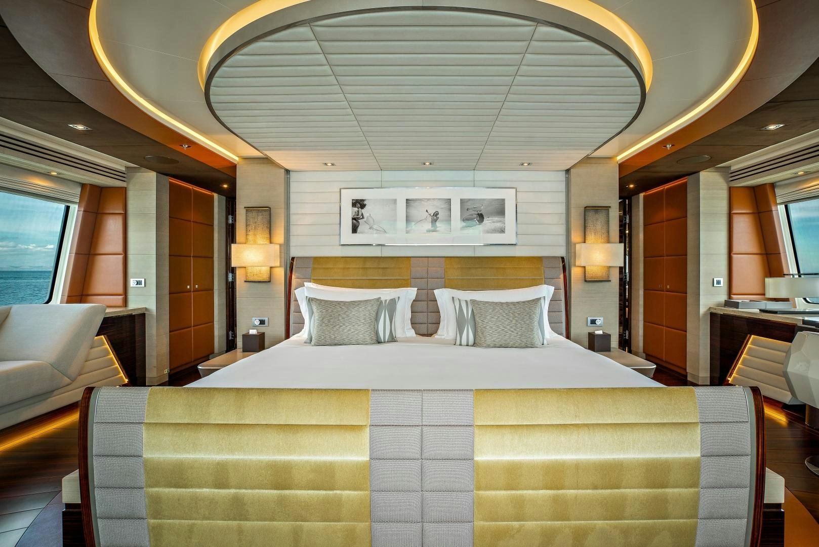 a bed in a hotel room aboard ODYSSEA Yacht for Charter