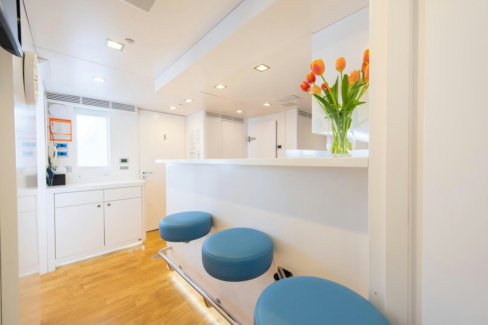 a vase of flowers on a counter aboard OCEAN'S SEVEN Yacht for Sale