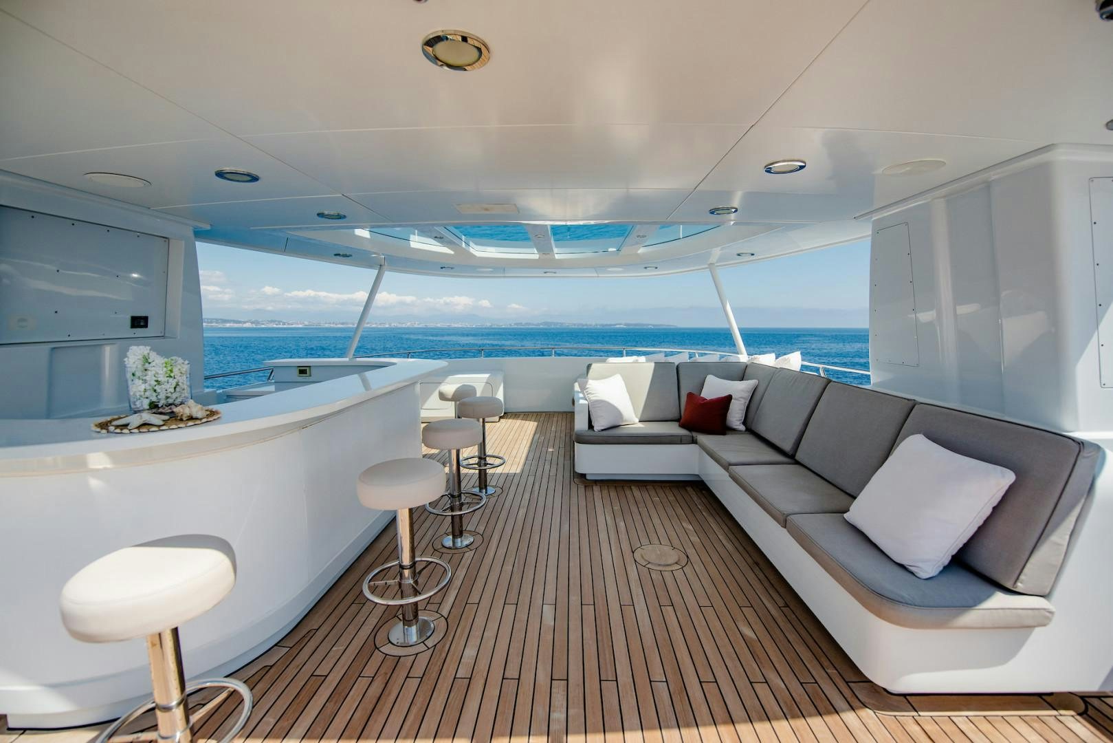 a living room with a couch and a table aboard OCEAN'S SEVEN Yacht for Sale