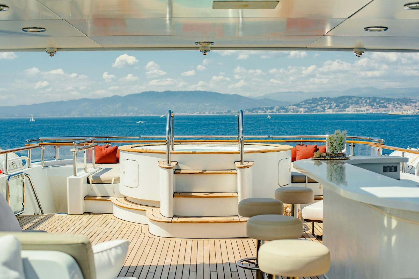 a room with a view of the ocean and a city aboard OCEAN'S SEVEN Yacht for Sale