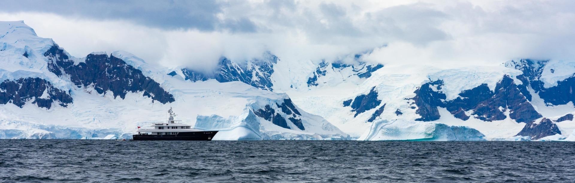 a large ship in the water aboard OCEAN'S SEVEN Yacht for Sale