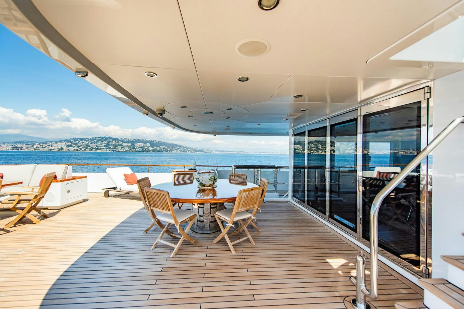 a room with a table and chairs aboard OCEAN'S SEVEN Yacht for Sale