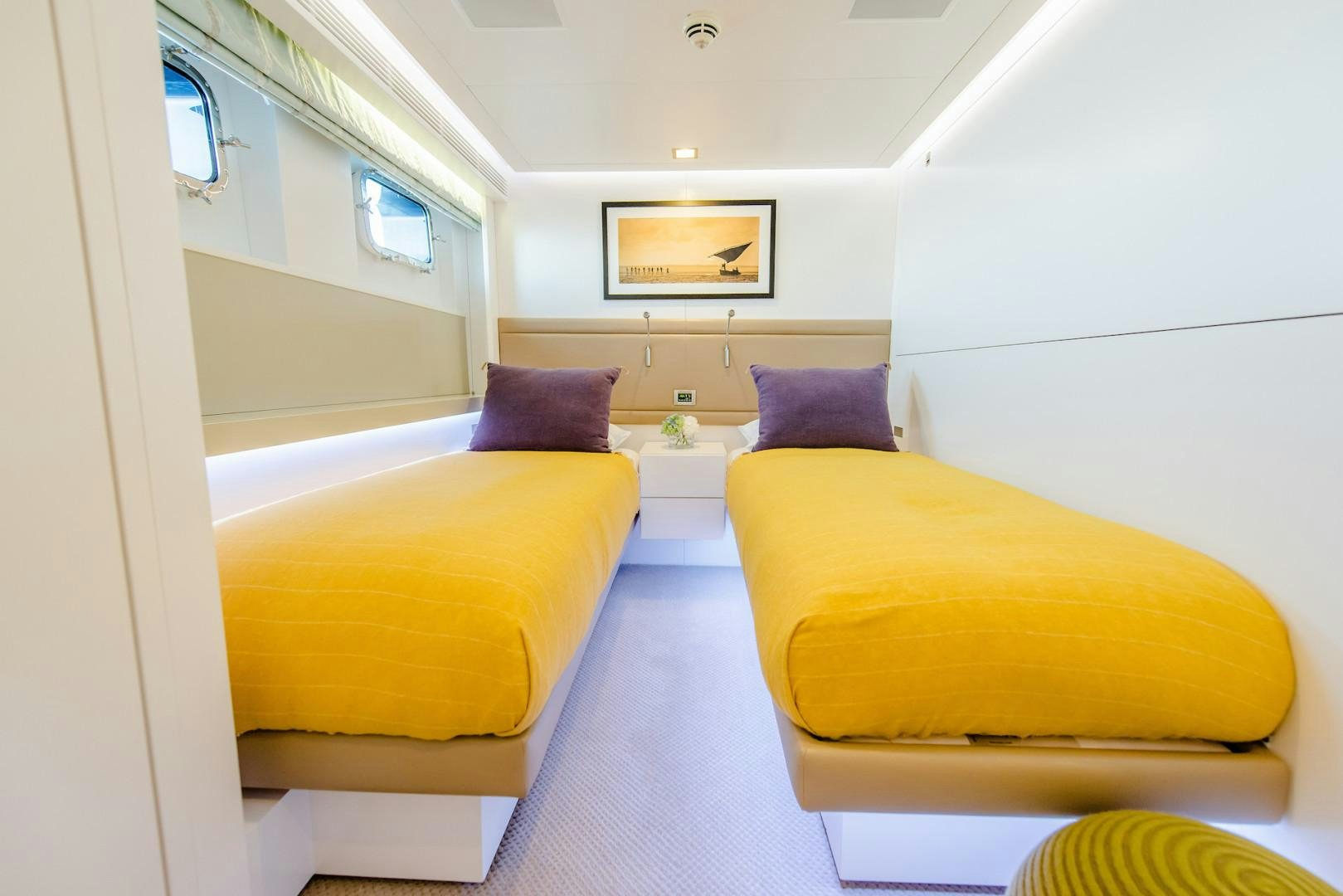 a room with a bed and a shelf aboard OCEAN'S SEVEN Yacht for Sale