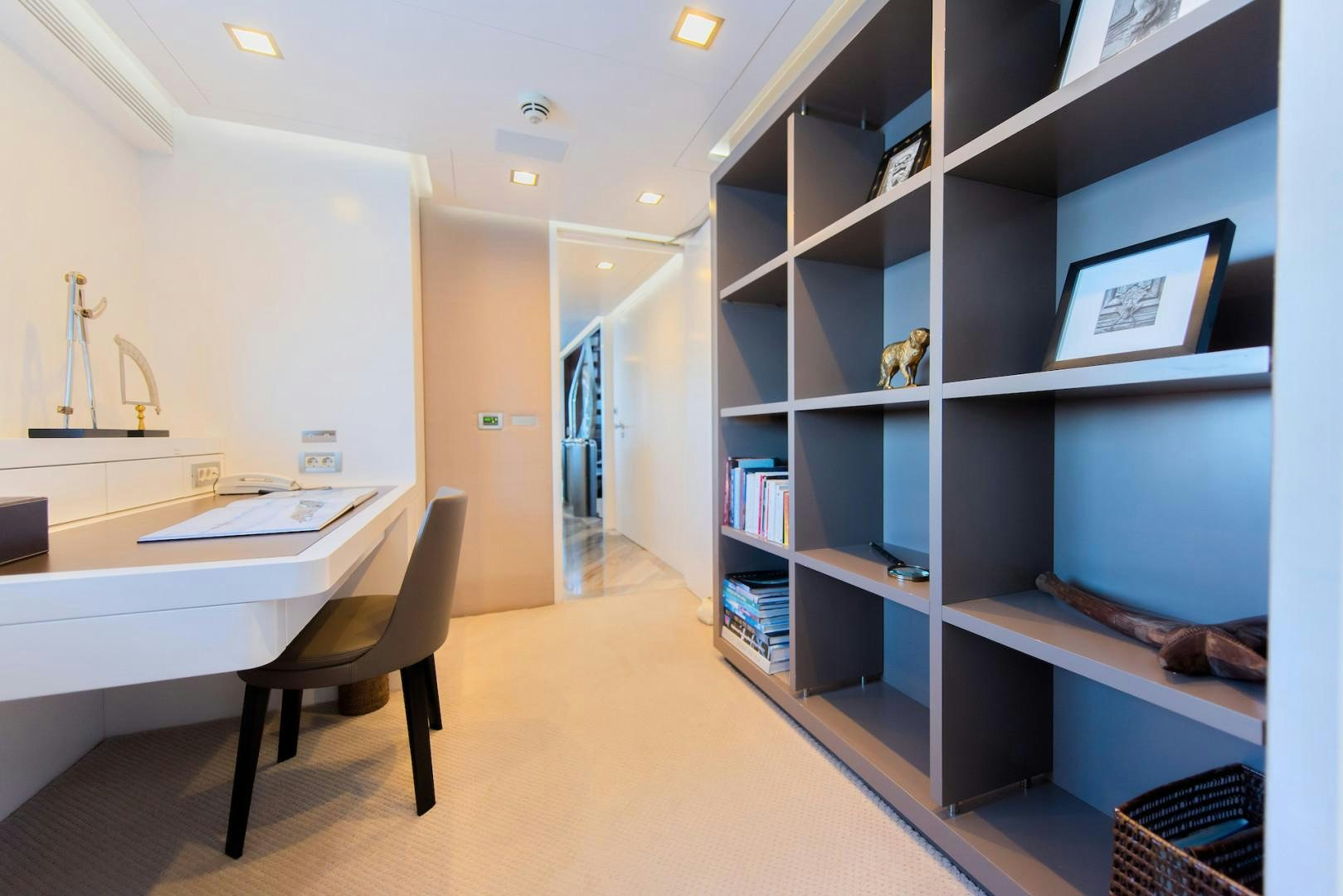 a room with shelves and a chair aboard OCEAN'S SEVEN Yacht for Sale