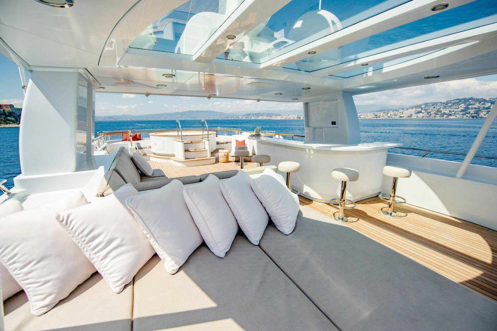 a room with a large bed and a large window aboard OCEAN'S SEVEN Yacht for Sale