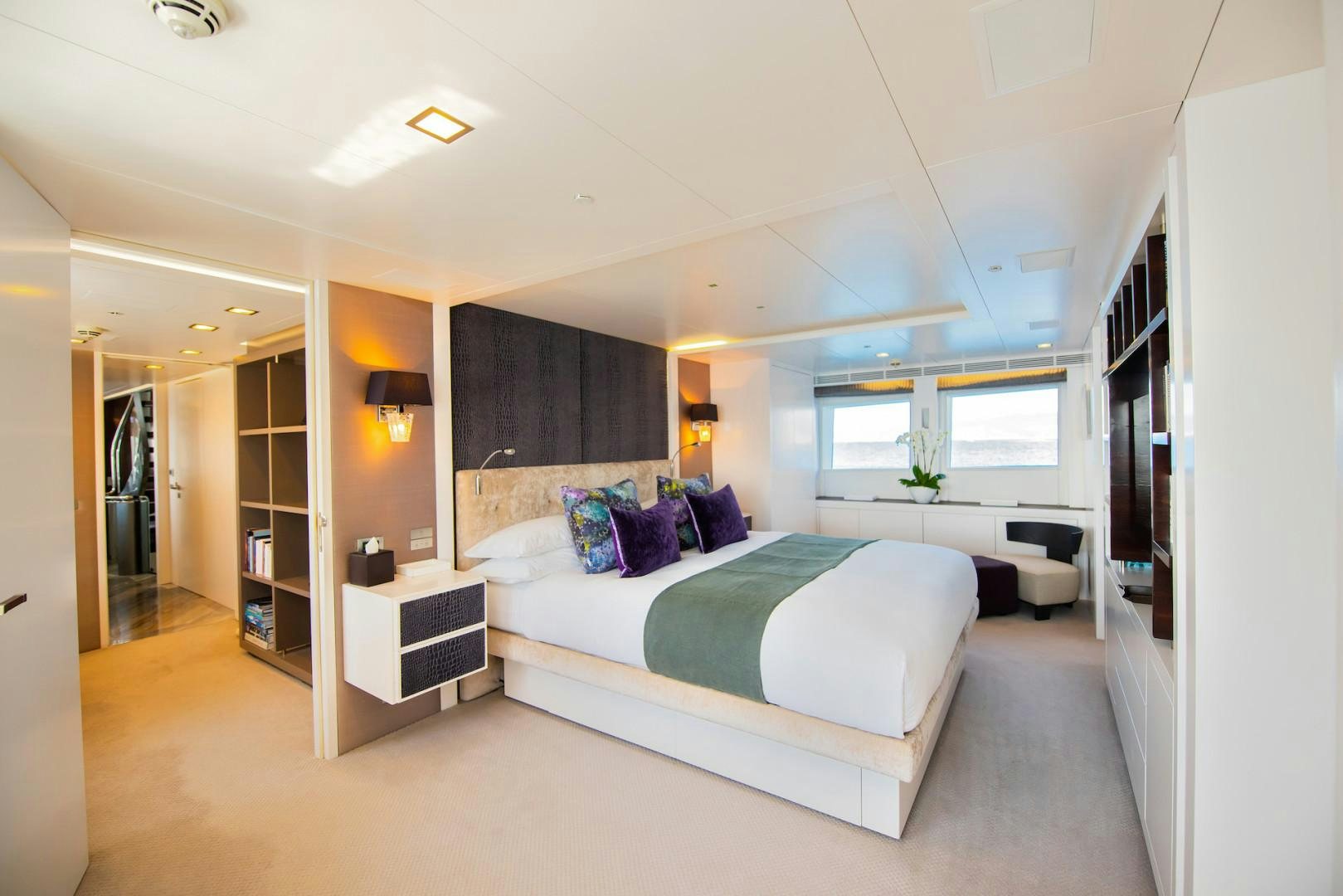 a large bedroom with a bed aboard OCEAN'S SEVEN Yacht for Sale
